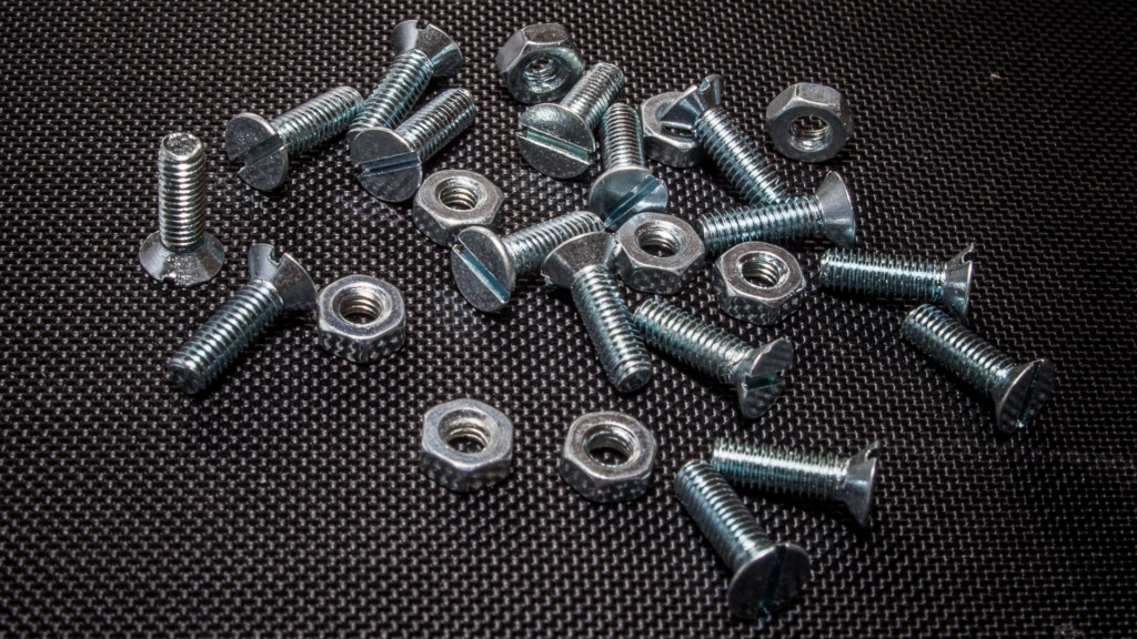 Key Takeaways: Passivation Creates A Double-Edged Sword: The process that protects against corrosion may leave threads vulnerable to galling without proper preventive measures. Prevention Requires A Multi-Layered Approach: Lubrication, coating selection, thread design, and installation control must work together. Compliance Documentation Is Non-Negotiable: Aerospace and defense programs demand audit-ready verification of galling prevention protocols. How To Prevent Galling After Passivation On Stainless Steel Threads Galling on stainless steel threads is one of those problems that catches teams off guard, particularly after passivation, when the very process applied to protect the surface inadvertently increases the risk of thread seizure. It is a paradox that frustrates engineers and procurement teams alike; the treatment meant to extend component life creates the conditions for premature failure. Valence Surface Technologies, the world's largest independent aerospace surface finishing company, processes stainless steel components to the strictest aerospace standards, with deep expertise in passivation processes and the downstream effects that impact fastener performance. In this piece, we will cover what causes galling after passivation, why stainless steel is particularly vulnerable, and the most effective strategies for preventing it on threaded fasteners. What Is Galling And Why Does It Occur On Stainless Steel Threads? Galling is cold welding between metal surfaces under pressure and friction. When stainless steel threads engage, microscopic surface asperities contact, generate heat, and create localized adhesion. Unlike wear or abrasion, galling involves actual material transfer between mating surfaces, leading to progressive thread destruction. Understanding how to prevent galling threaded fasteners starts with recognizing the surface chemistry and mechanical conditions that make stainless steel uniquely susceptible. The Mechanics Behind Thread Seizure Austenitic stainless steels are prone to adhesive wear due to their ductility, work-hardening behavior, and tendency to form strong metallic junctions under pressure and during sliding. During tightening, contact pressure exceeds the material's yield strength at microscopic points. The protective oxide layer breaks down under shear stress, exposing fresh metal that instantly bonds with the mating surface. Continued rotation tears material from one surface and deposits it on the other, building up until the fastener locks completely. Material Properties That Increase Galling Risk Both 304 and 316 stainless steels are susceptible to galling. These austenitic alloys exhibit high ductility and work-hardening characteristics, meaning threads deform rather than shear cleanly under stress. The strain-hardening effect progressively increases surface hardness during installation, creating even stronger adhesive bonds. Relative galling behavior depends on hardness, surface finish, lubrication, thread geometry, and assembly conditions rather than alloy grade alone. Alt Image Text: What Is Galling And Why Does It Occur On Stainless Steel Threads? The Relationship Between Passivation And Galling On Stainless Steel Passivation of stainless steel is commonly specified for aerospace corrosion-resistant steel components, often using AMS 2700 when required by drawing, purchase order, or program specification. This treatment chemically removes free iron and surface contaminants while supporting the formation of a chromium-rich passive film. However, passivation fundamentally alters surface characteristics, requiring additional galling-prevention measures. For programs managing stainless steel galling passivation risks, understanding what happens at the surface level after treatment is essential to building an effective prevention strategy. How Surface Chemistry Changes After Passivation Passivation chemically cleans the surface and supports the formation of a chromium-rich passive film, but it does not necessarily smooth the surface or eliminate topographical variation. Freshly cleaned and passivated stainless surfaces may have fewer contaminant films separating mating threads; however, the passive oxide layer itself is intended to reduce chemical reactivity and improve corrosion resistance. Without subsequent protective treatment or lubrication, clean metal-to-metal contact can increase adhesion potential during thread engagement. The Clean Surface Challenge Clean surfaces can experience greater true metal-to-metal contact area than contaminated or pre-lubricated surfaces. When passivated threads engage uniformly across the entire thread form, distributed contact increases total adhesive force compared to rougher surfaces where contact occurs only at peak points. Why Passivated Stainless Steel Fasteners Are More Susceptible To Galling The timing of passivation in the manufacturing sequence creates inherent vulnerability. Parts are typically passivated as a final chemical operation after machining and deburring. This means threads receive no subsequent protective treatment unless specifically applied as a separate finishing step. Thread Tolerance Impact Aerospace specifications demand tight thread tolerances for structural integrity and vibration resistance. Class 3A/3B threads provide tighter-tolerance fits than Class 2A/2B and can increase sensitivity to surface condition, lubrication, and assembly control. Combined with passivation's clean surface condition, this geometric precision can maximize contact pressure and galling risk without proper preventive measures. Alt Image Text: Passivated Stainless Steel Fasteners Common Causes Of Galling After Passivation In Aerospace Applications Multiple operational factors compound passivation-related galling risk in mission-critical manufacturing. Installation Speed and Technique Variations Improperly controlled power-tool installation, especially at high speed, poor alignment, or inadequate torque control, can increase heat and friction, raising the risk of galling. Operator technique variations across shifts introduce quality inconsistencies even with identical fasteners. Environmental Contamination Post-Passivation If handling, packaging, storage, or transport controls are inadequate, passivated parts may accumulate films or particulates that affect lubrication and assembly performance. Moisture, oils, and contaminants alter surface chemistry unpredictably, rendering engineered galling-prevention measures ineffective. Material Pairing Issues Mating passivated stainless fasteners with dissimilar materials, aluminum structures, titanium fittings, or other stainless grades creates galvanic and mechanical compatibility challenges. Each combination exhibits unique friction characteristics and load distribution patterns affecting galling susceptibility. How To Prevent Galling On Passivated Stainless Steel Threaded Fasteners Systematic prevention requires addressing surface treatment, mechanical design, and assembly procedures simultaneously. Pre-Passivation Surface Preparation Thread surface condition entering passivation significantly impacts final assembly performance. Deburring quality, machining marks orientation, and pre-cleaning effectiveness set baseline conditions. Parts should be properly cleaned before passivation because oils and organic residues can interfere with the process. Controlled Passivation Processing Process variables, acid concentration, temperature, and immersion time must remain within their specified ranges. We maintain real-time process monitoring and statistical process control across all chemical operations, ensuring consistent oxide layer formation. To learn more about how we manage this process, explore our full range of services built around aerospace-grade surface finishing requirements. Thread Design Optimization Where design authority permits, specifying Class 2A/2B threads instead of Class 3A/3B provides additional clearance that can reduce contact pressure sensitivity. Thread relief grooves, reduced engagement length, and optimized thread-form modifications may reduce the probability of galling without compromising joint integrity, subject to design approval. Coating And Lubrication Solutions That Reduce Galling Risk After Passivation Post-passivation surface treatments provide mechanical separation between mating threads. Dry Film Lubricants Molybdenum disulfide, PTFE, and graphite-based coatings can reduce galling risk by lowering friction and separating surfaces. These treatments must withstand aerospace environmental requirements while maintaining dimensional tolerances. Application must occur post-passivation as a separate finishing operation. Selection must be application-specific, taking into account temperature, humidity, vacuum exposure, and contamination restrictions. Silver and Copper Plating Thin, precious-metal deposits provide sacrificial layers with superior lubricity compared to stainless substrates. Silver plating per AMS 2410 is a recognized anti-galling and conductive surface treatment, though electrical bonding performance still requires design- and process-specific verification. Where silver plating is not suitable, our nickel plating capabilities offer an alternative protective layer with proven wear resistance and compatibility across a wide range of aerospace fastener applications. Anti-Seize Compounds Thread lubricants containing metallic particles or solid lubricants reduce friction coefficients during installation. Selection must consider temperature exposure, chemical compatibility, and contamination concerns in assembled systems. For applications requiring maximum surface durability, our chrome plating services provide an additional hard-surface option that can be evaluated alongside anti-seize strategies to deliver the most effective protection for mission-critical threaded assemblies. Aerospace specifications often restrict permissible compounds based on program requirements. Alt Image Text: Silver Plating Final Thoughts Preventing galling after passivation on stainless steel threads demands technical precision and systematic process control. The surface chemistry changes that protect against corrosion may leave threads vulnerable to adhesive wear, a reality that aerospace manufacturers must address through engineered finishing sequences, appropriate coating selection, and rigorous quality verification. Success requires understanding the interplay between metallurgy, surface treatment, mechanical design, and assembly procedures. Valence's purpose-built platform delivers the integrated capability, technical depth, and production capacity that mission-critical programs require. Our consolidated approach eliminates the vendor coordination challenges that compromise quality outcomes while maintaining the compliance rigor that aerospace manufacturing demands. Frequently Asked Questions About How To Prevent Galling After Passivation On Stainless Steel Threads How does passivation impact the surface properties of stainless steel and its susceptibility to galling? Passivation creates more chemically stable surfaces with enhanced corrosion resistance but reduced natural lubricity. These surface changes, combined with high thread loads and metal-to-metal contact, increase the potential for adhesive wear if proper lubrication and assembly controls are not implemented. What industry standards and compliance requirements govern threaded components in defense and space manufacturing? Aerospace threaded components must comply with ASTM A967 for passivation, AMS 2700 for processing requirements, ASME B1.1 for thread specifications, and program-specific specifications addressing galling prevention and assembly procedures. What pre-passivation strategies are most effective for reducing galling risk in mission-critical applications? Thread tolerance optimization, surface finish specification control, and design reviews addressing engagement geometry reduce galling risk before passivation processing begins. How should lubrication be applied before passivation to prevent galling without compromising surface treatment? Lubricants must be applied after passivation is complete to avoid chemical interference; pre-passivation lubrication contaminates the treatment chemistry and prevents proper oxide layer formation. Which testing protocols should be used to verify galling-prevention measures before production release? Torque-tension testing, thread engagement cycling, and accelerated wear evaluation under representative assembly conditions verify the effectiveness of galling prevention before a full production commitment. How can organizations implement audit-ready documentation systems to demonstrate compliance? Unified Quality Management Systems capturing passivation parameters, coating specifications, assembly procedures, and verification testing results in traceable formats satisfy aerospace audit requirements and regulatory standards.